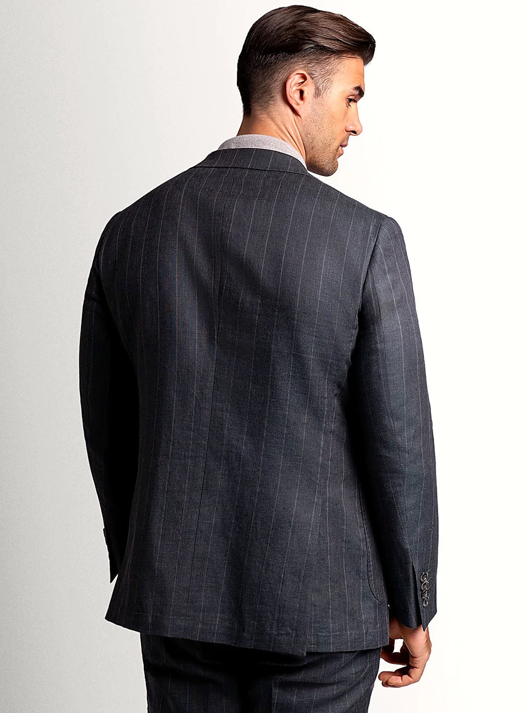 Lapel and chest pocket detail of the olive jacket