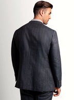 Lapel and chest pocket detail of the olive jacket