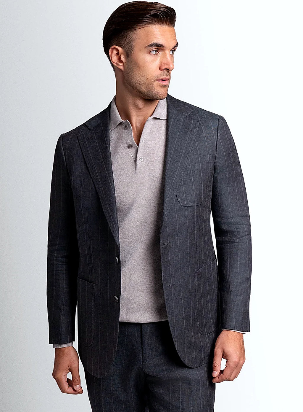 Olive green pinstripe jacket worn open over a shirt