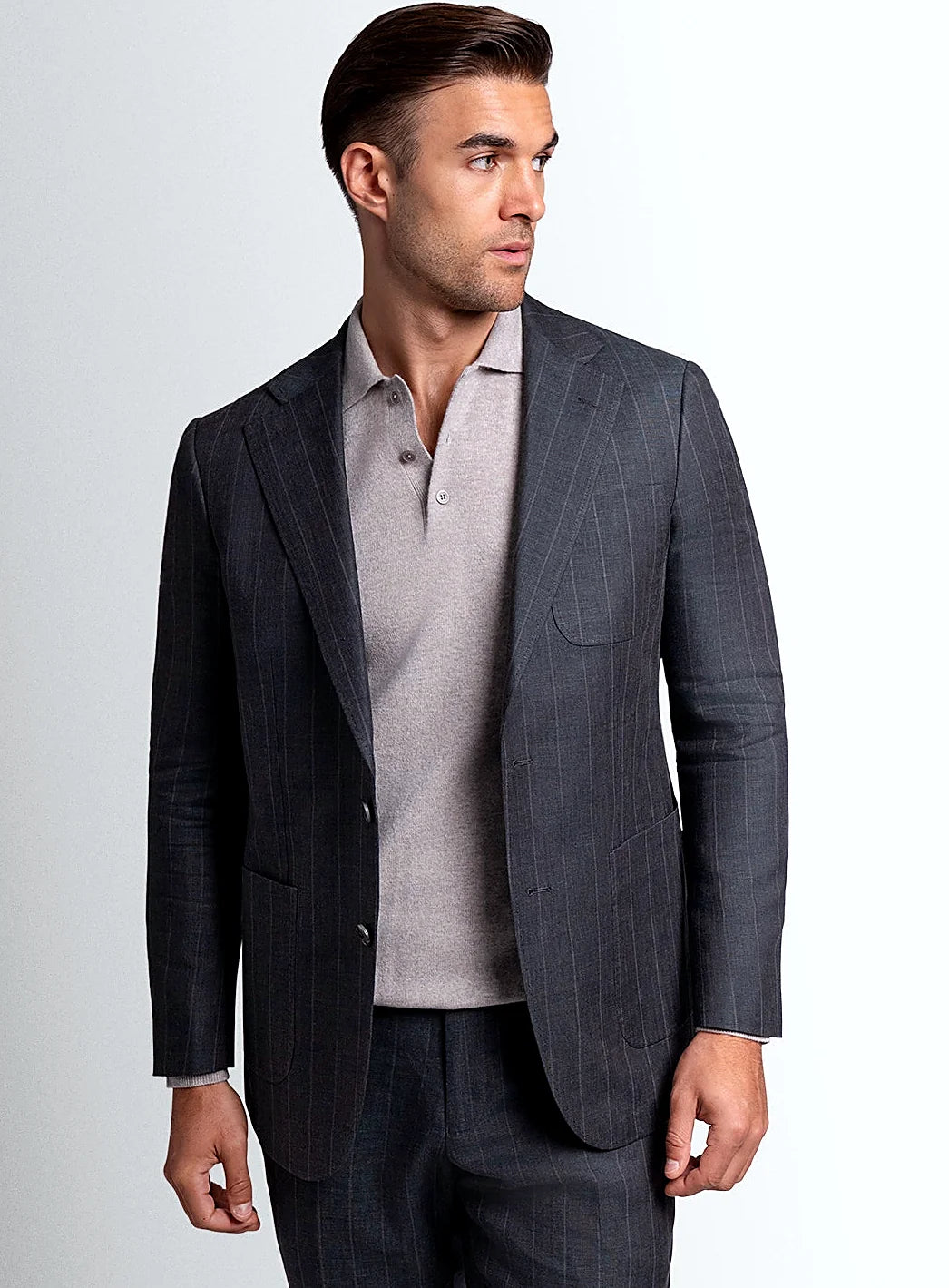 Olive green pinstripe jacket worn open over a shirt