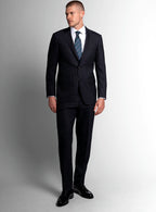 Three-quarter view of the charcoal jacket and trousers