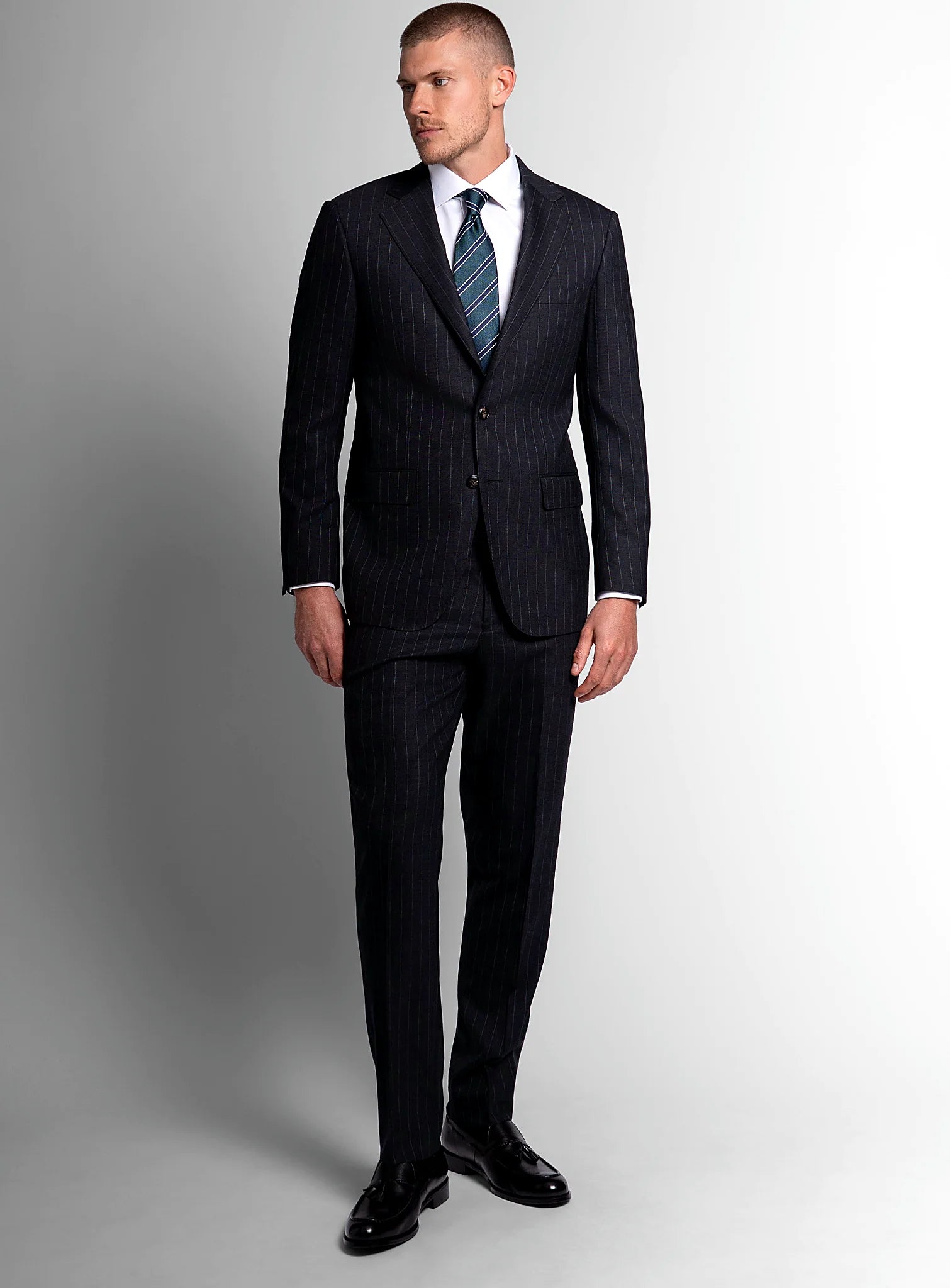 Three-quarter view of the charcoal jacket and trousers