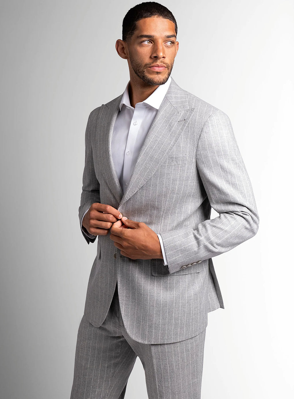 Silver grey pinstripe jacket worn open over a shirt
