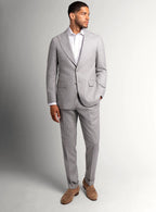Peak lapel and chest pocket detail of the grey jacket