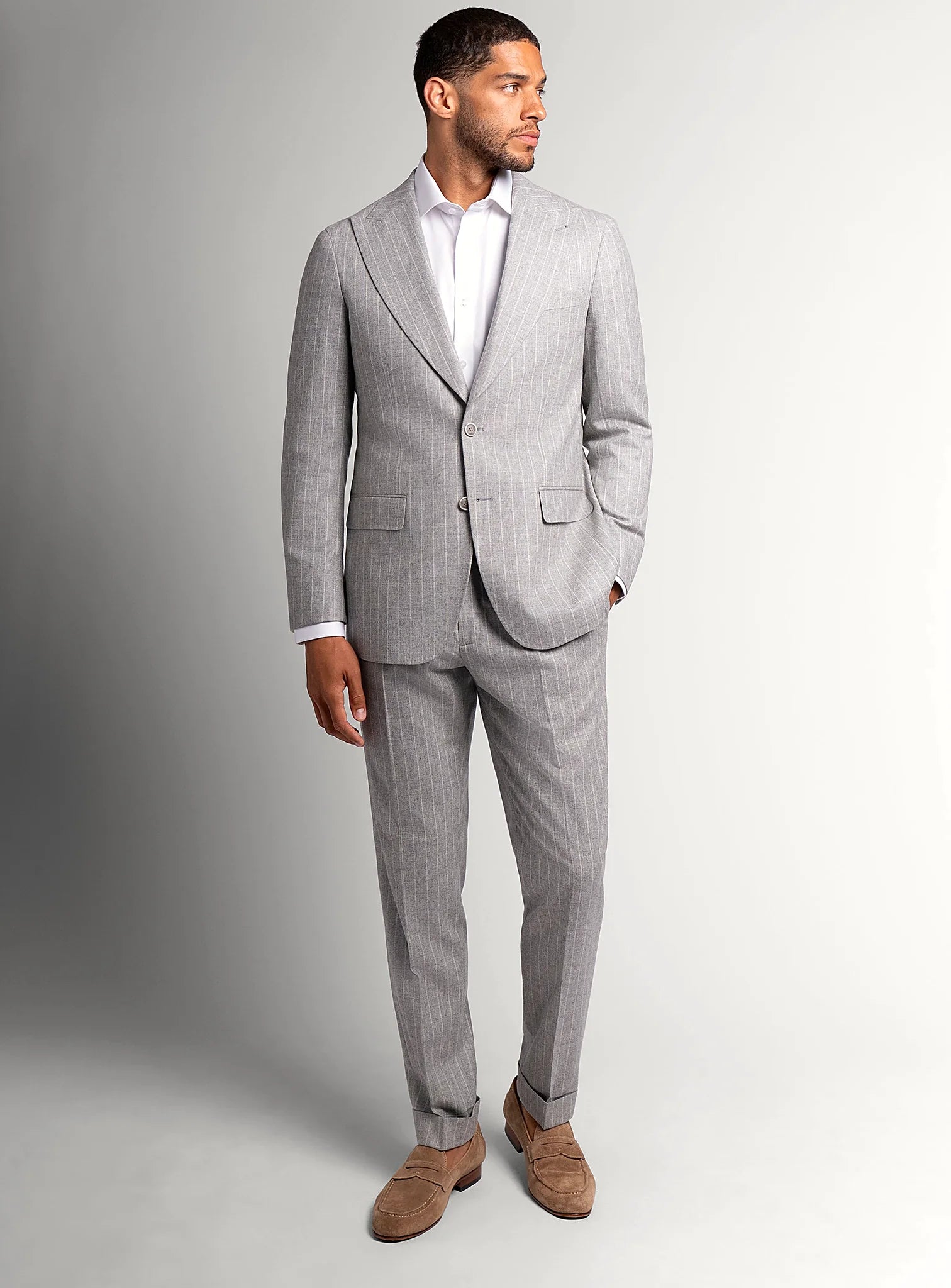Peak lapel and chest pocket detail of the grey jacket