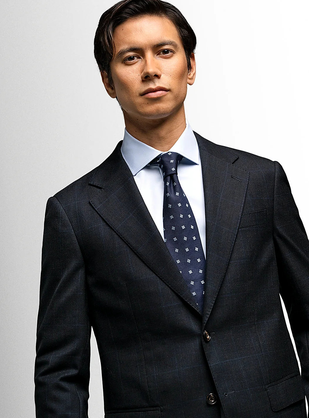 Prince of Wales check suit worn full length on a model