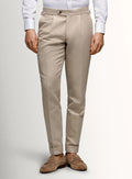 Taupe canvas trousers shown full length on a model