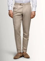 Taupe canvas trousers shown full length on a model