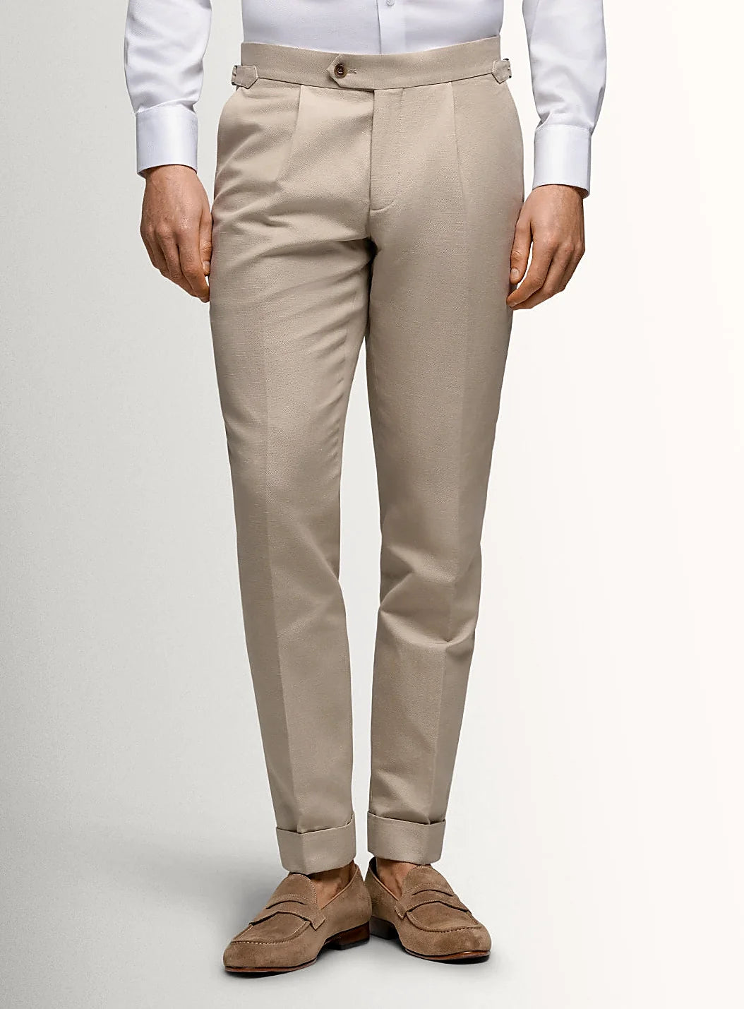 Taupe canvas trousers shown full length on a model