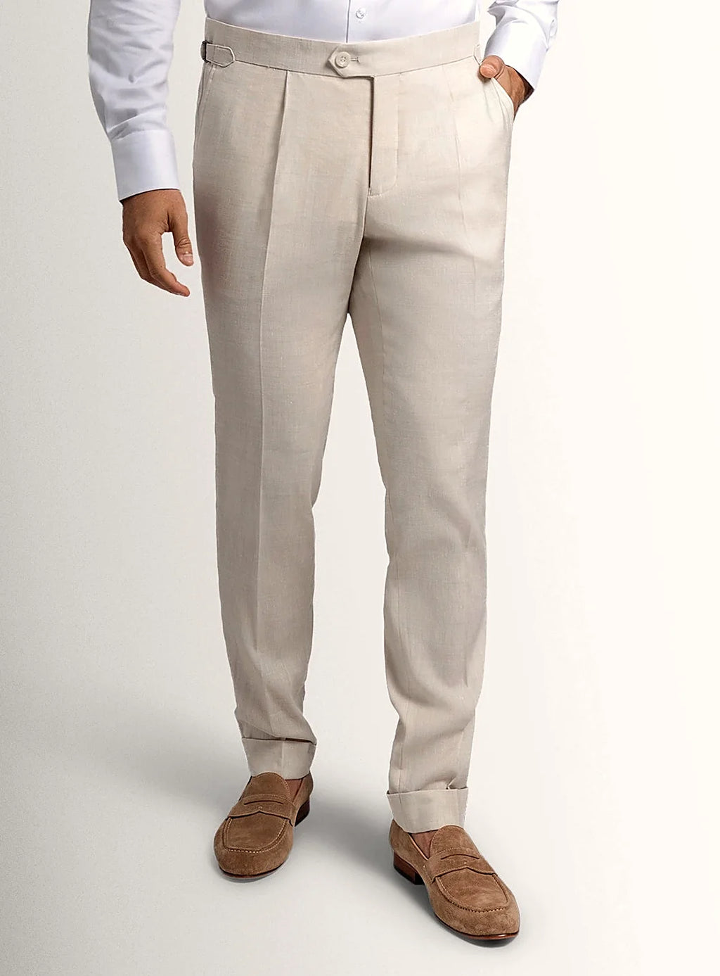 Cream tailored trousers shown full length on a model