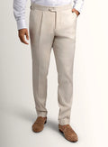 Cream tailored trousers shown full length on a model