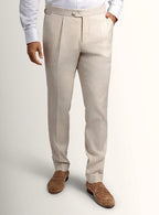 Cream tailored trousers shown full length on a model