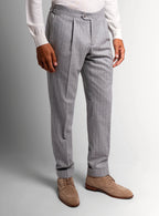Silver pinstripe trousers shown full length on a model