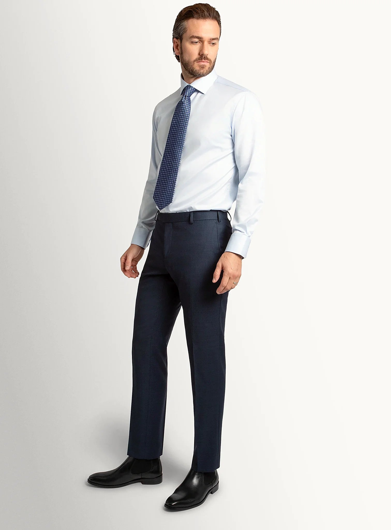 Side view of the tapered navy trouser leg
