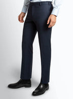 Navy birdseye trousers shown full length on a model