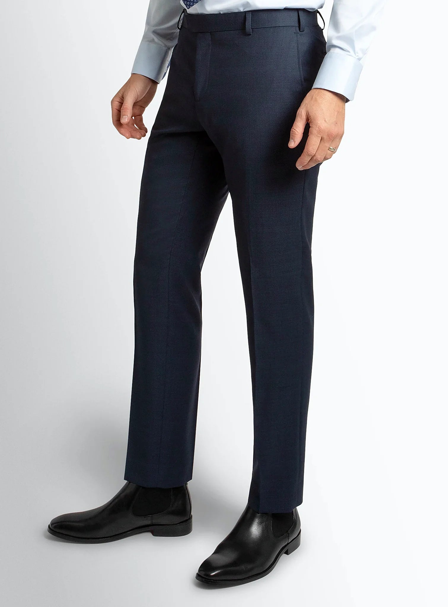 Navy birdseye trousers shown full length on a model