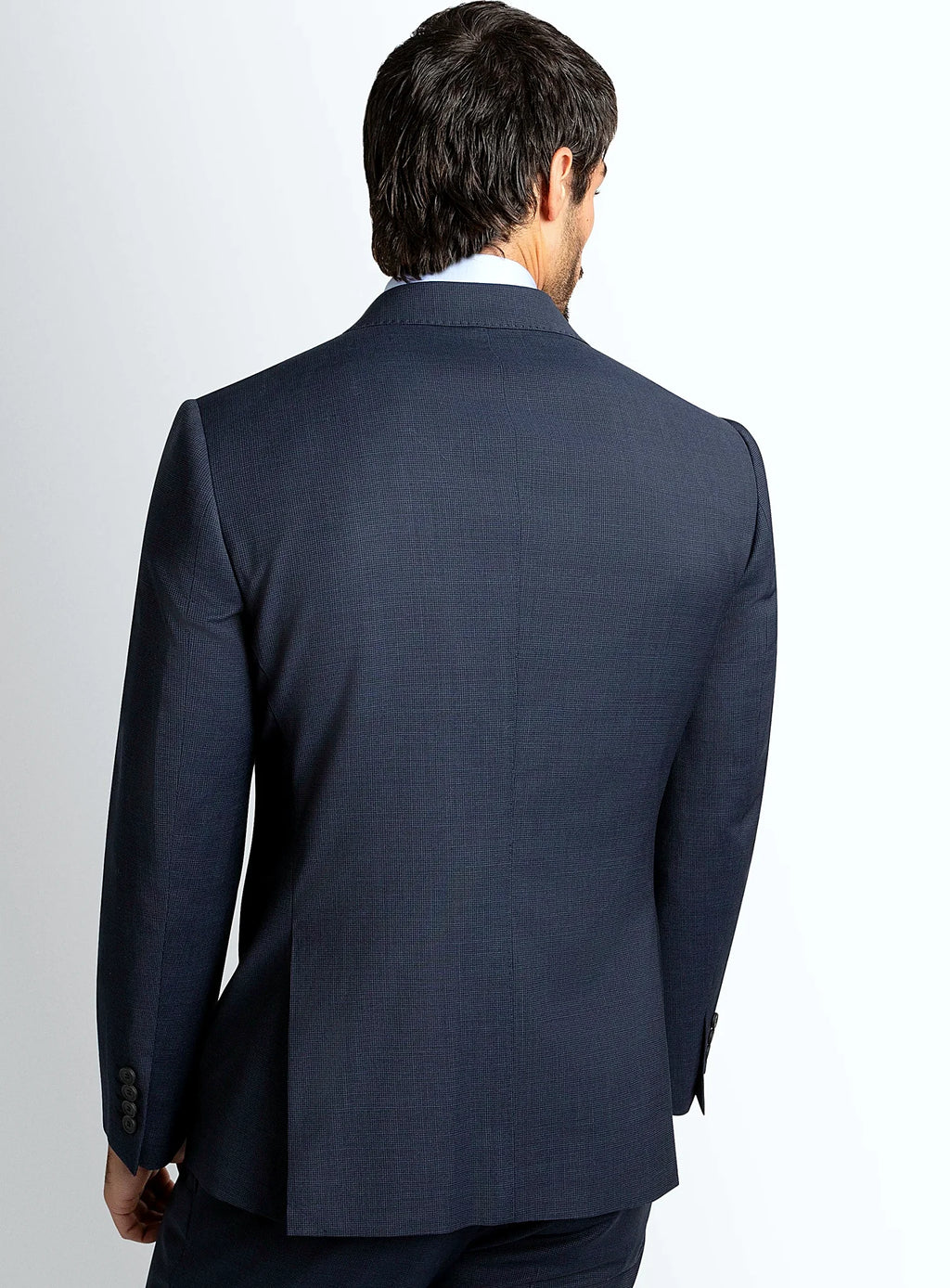 Lapel and front button detail of the navy jacket