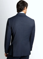 Lapel and front button detail of the navy jacket