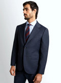Navy micro-check jacket worn over a plain shirt