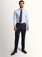 Side view of the navy trouser leg and hem