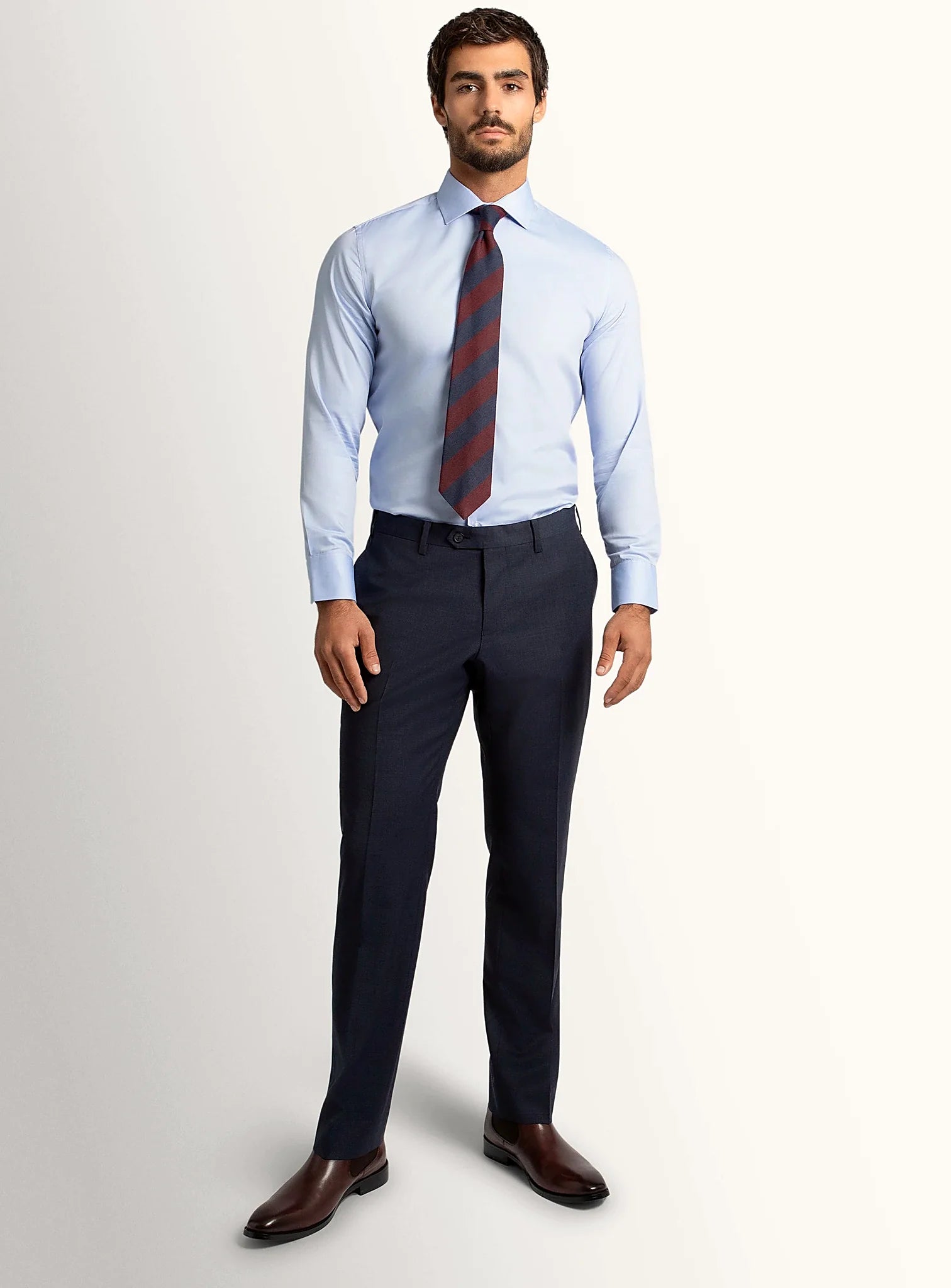 Side view of the navy trouser leg and hem