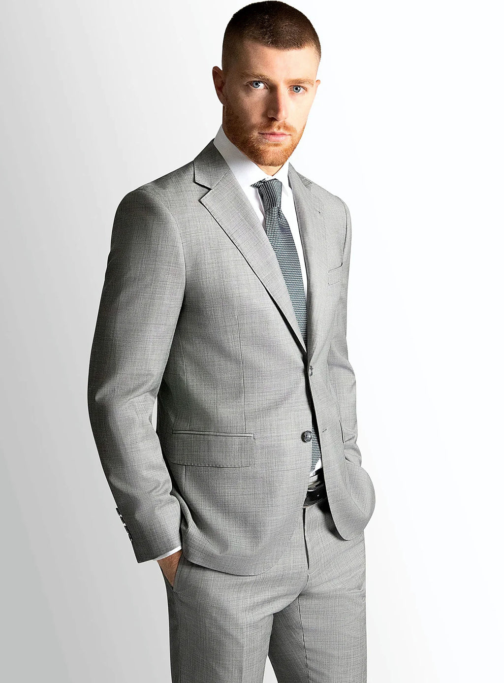 Silver grey sharkskin jacket worn over a white shirt