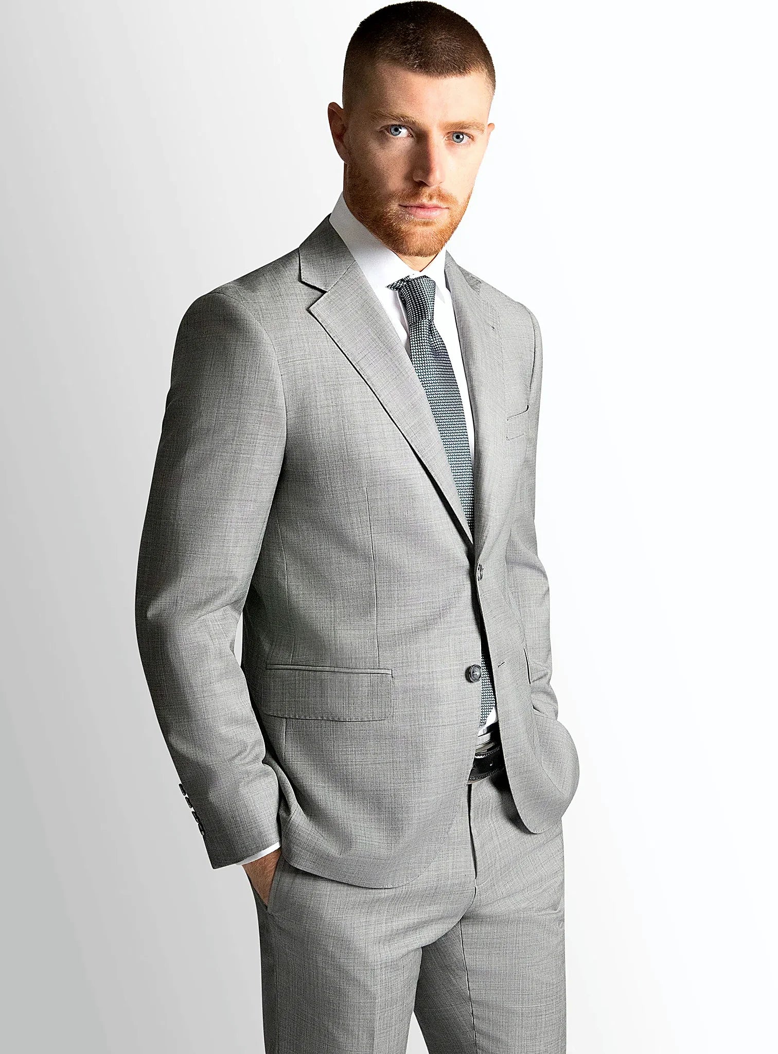 Silver grey sharkskin jacket worn over a white shirt