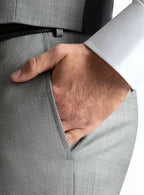 Waistband and front detail of the grey trousers