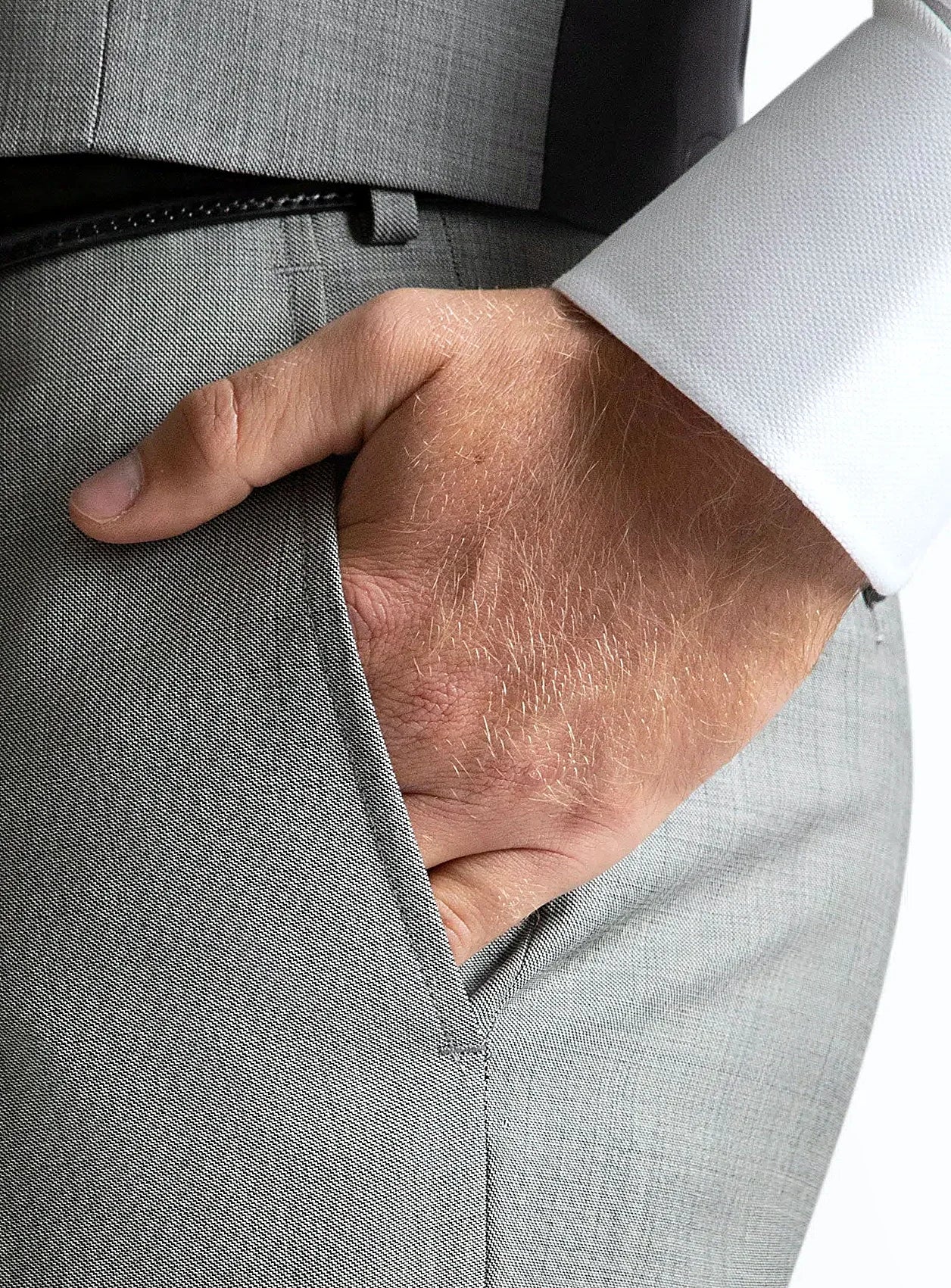 Waistband and front detail of the grey trousers