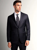 Black suit jacket worn over a white shirt