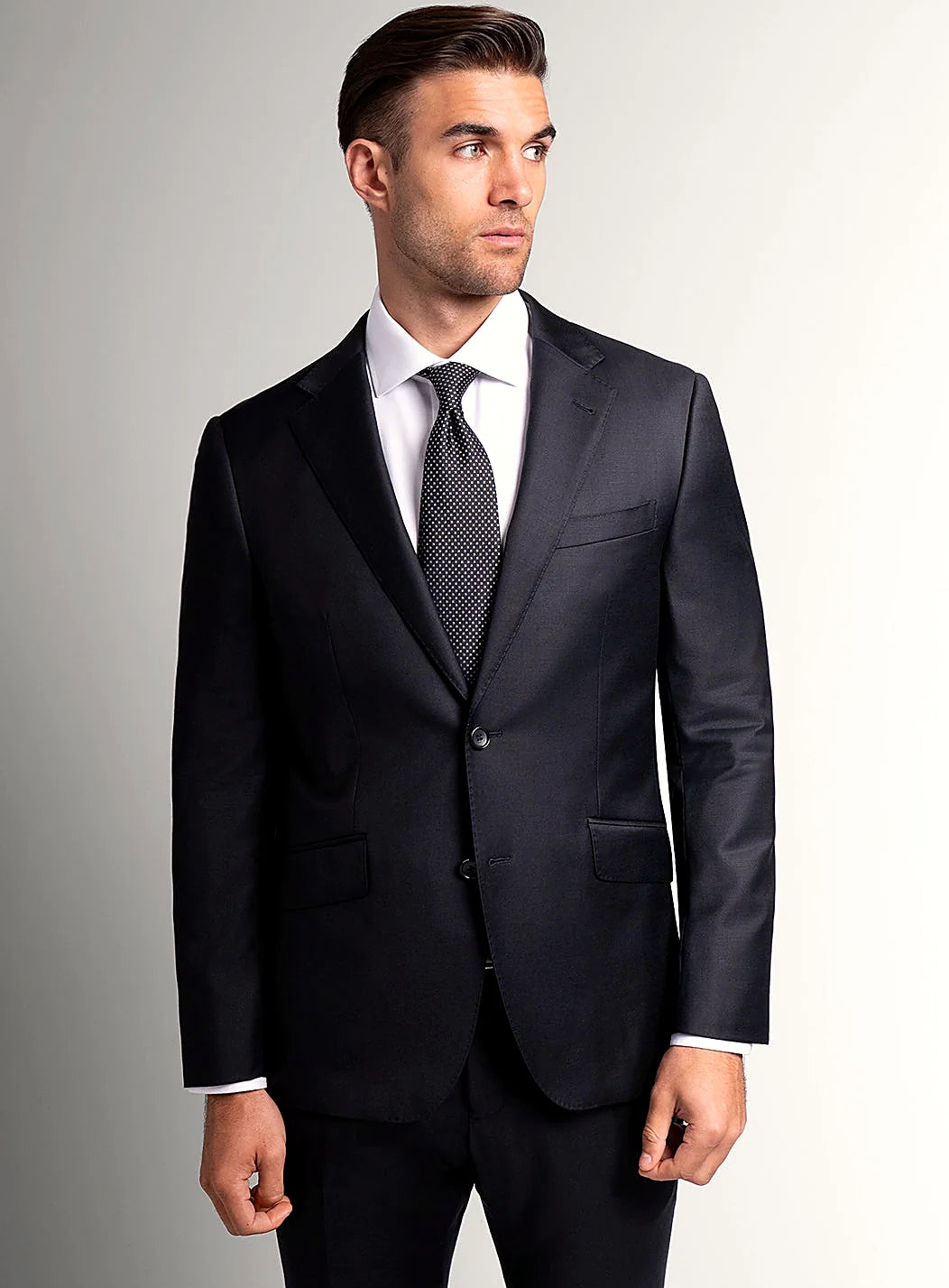 Black suit jacket worn over a white shirt
