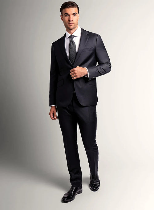 Angled view of the slim-fit black jacket