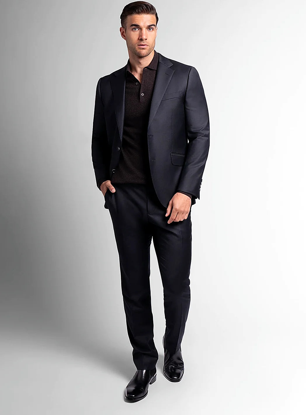 Lapel and front button detail of the black jacket