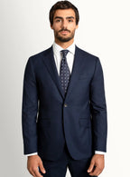 Navy twill suit jacket worn over a crisp shirt
