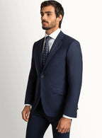 Lapel and flap pocket detail of the navy jacket