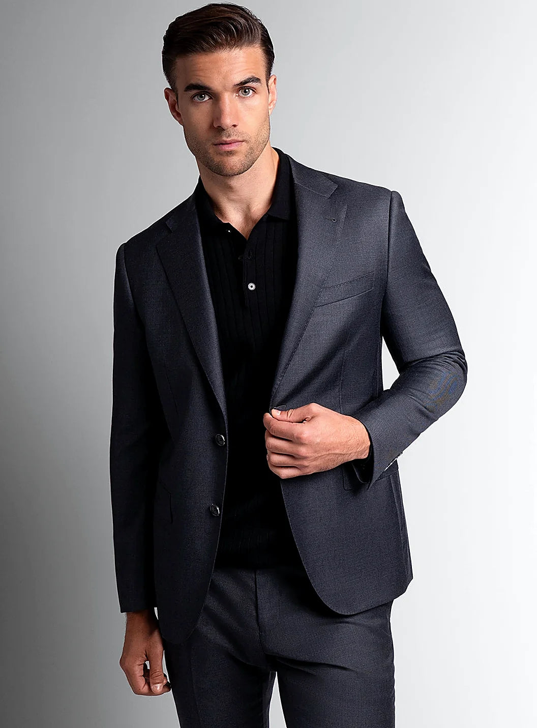Charcoal suit jacket worn over a white shirt