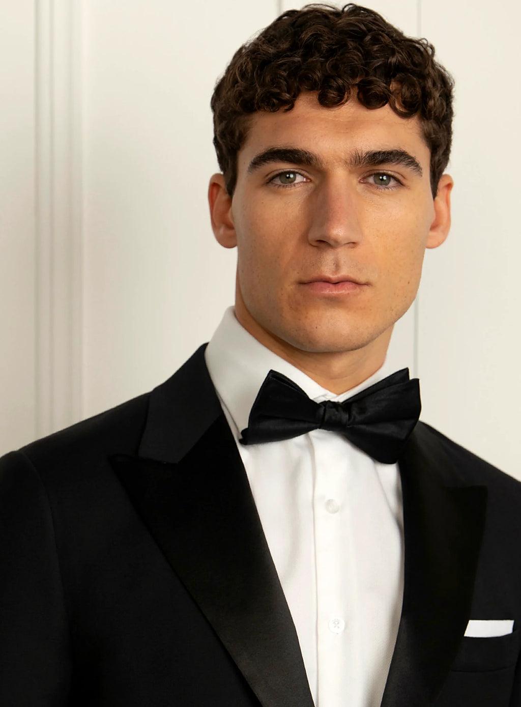 Close view of the satin facing on the peak lapel