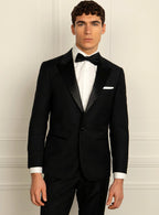 Black dinner suit worn full length with a formal shirt