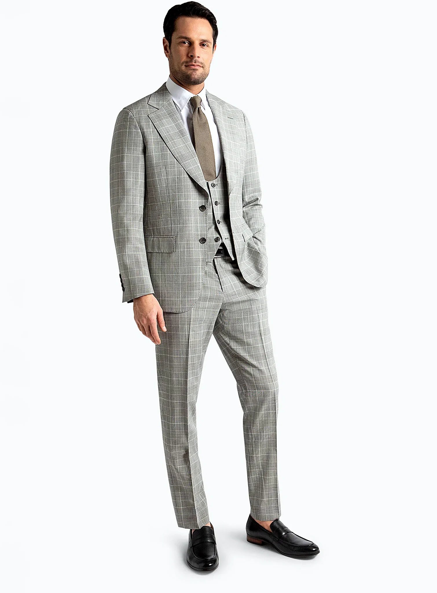 Three-quarter view of the checked jacket and trousers