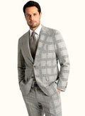 Grey frame check suit worn full length with a white shirt