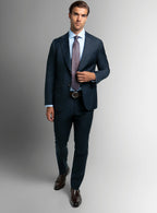 Three-quarter view of the navy jacket and trousers