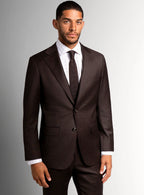 Lapel and buttoning detail of the brown suit jacket