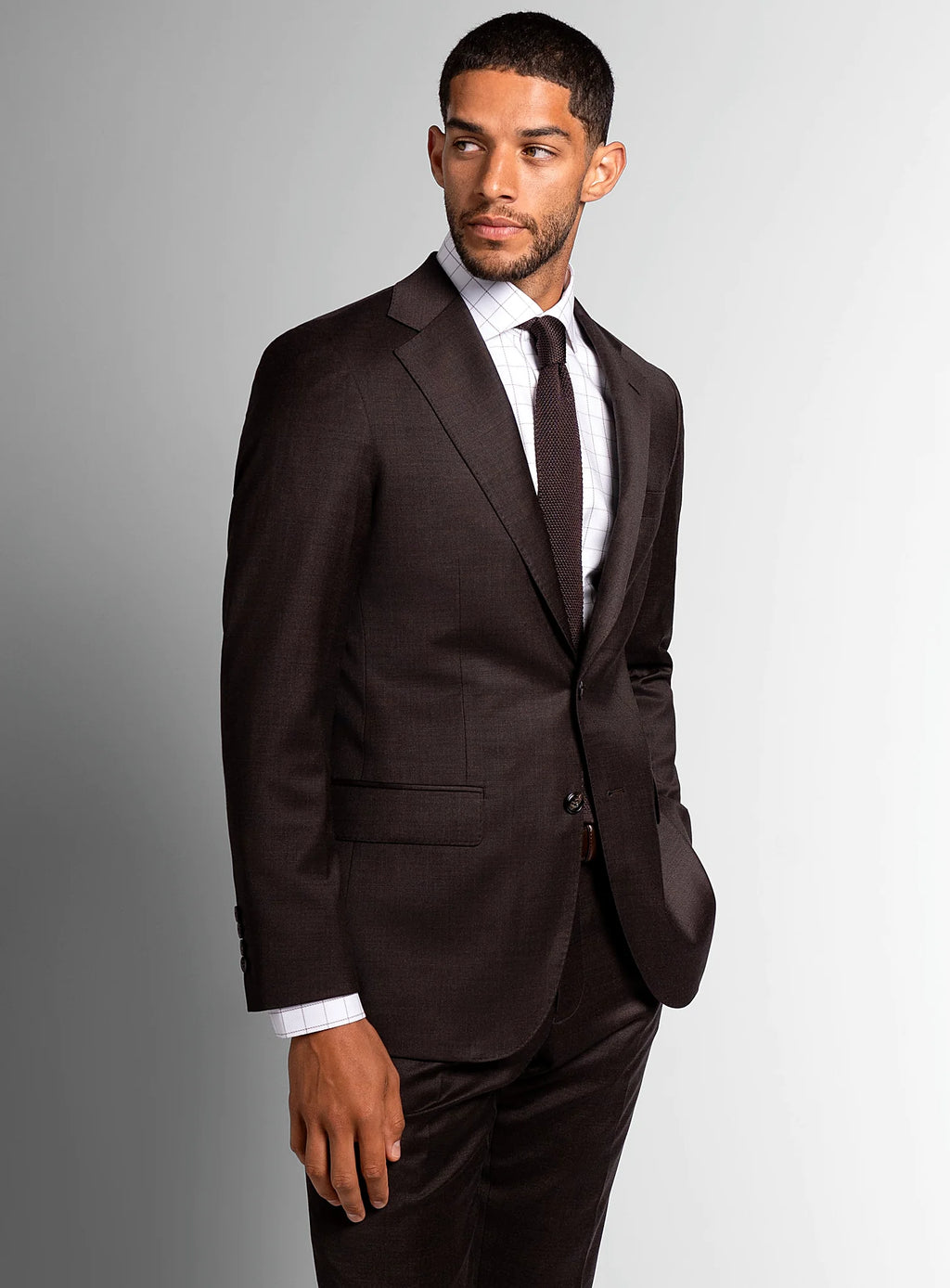 Chocolate brown suit worn full length with a pale shirt