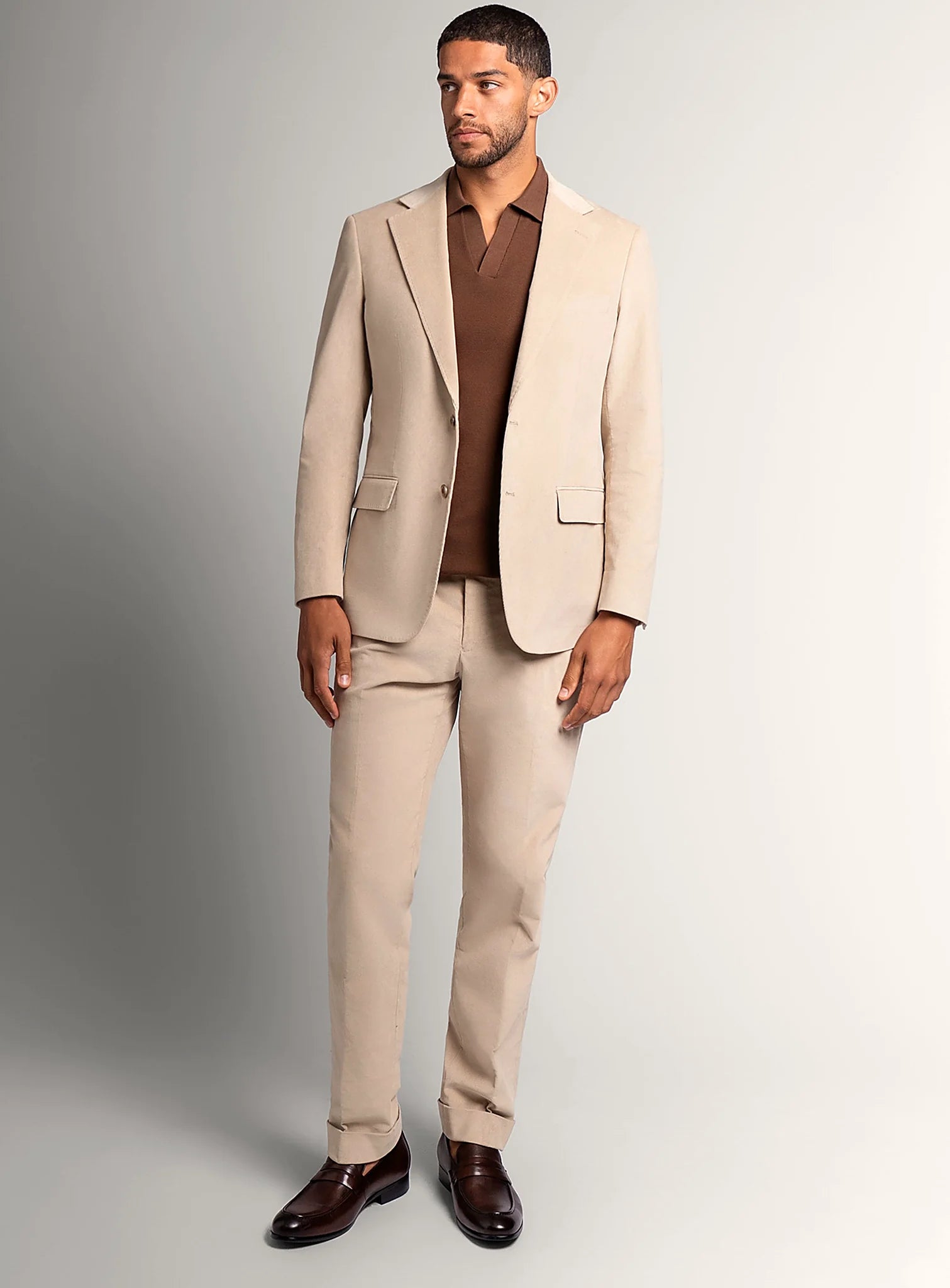 Waistband and front detail of the beige trousers