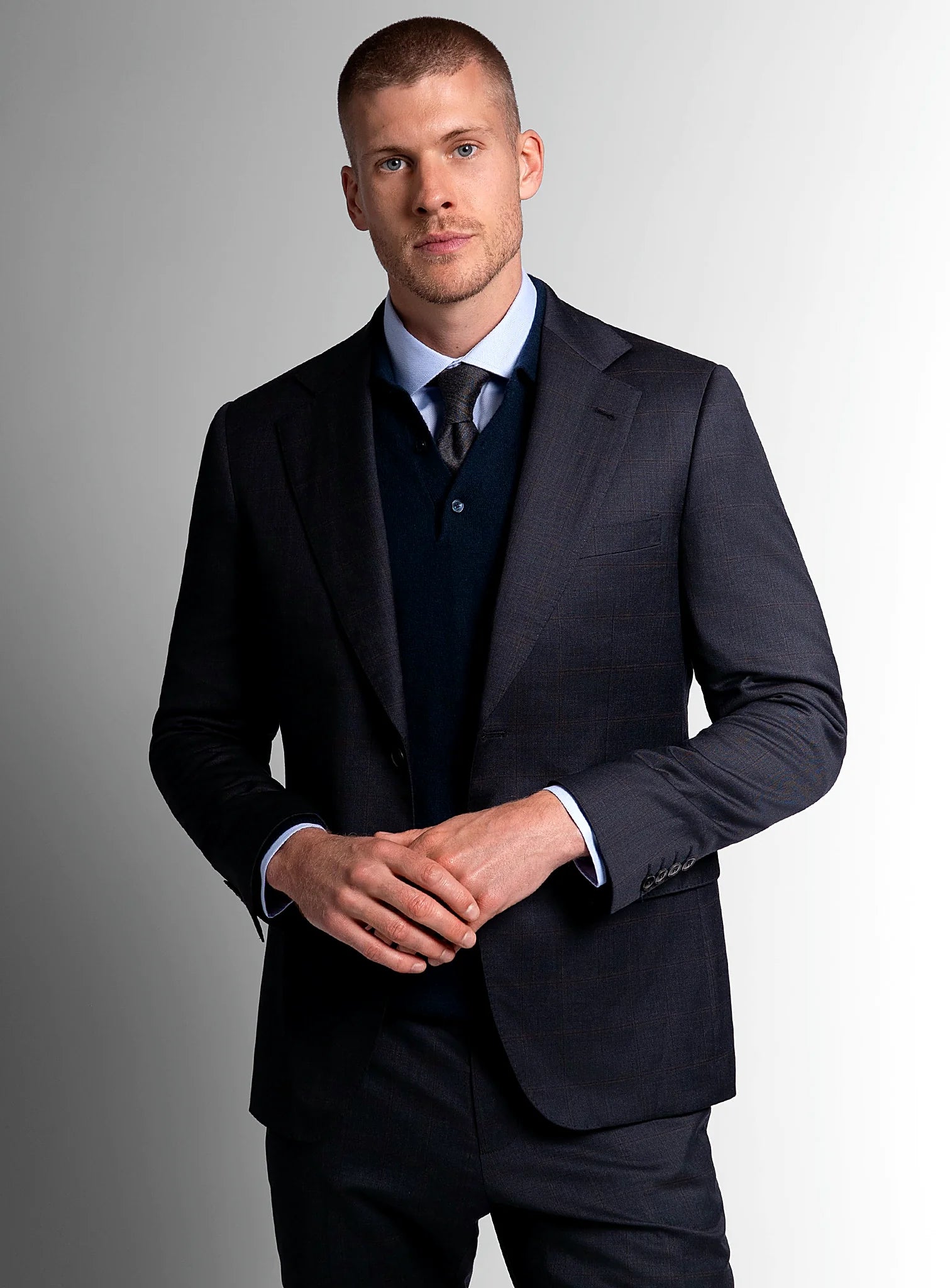 Navy overcheck suit shown full length with a plain shirt
